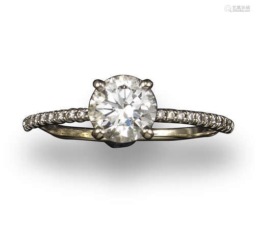 A diamond solitaire ring, the round brilliant-cut diamond weighs approximately 0.90cts and is claw-