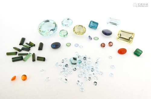 A mixed group of loose stones, including a pair of circular-cut fire opals, 0.90cts total, an