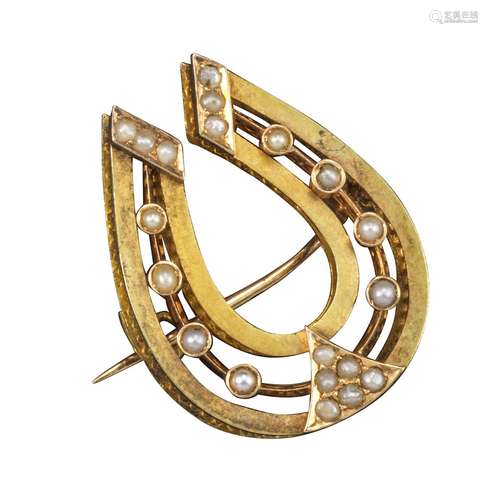 A late 19th century Russian horseshoe gold brooch, set with seed pearls and with wide honeycomb