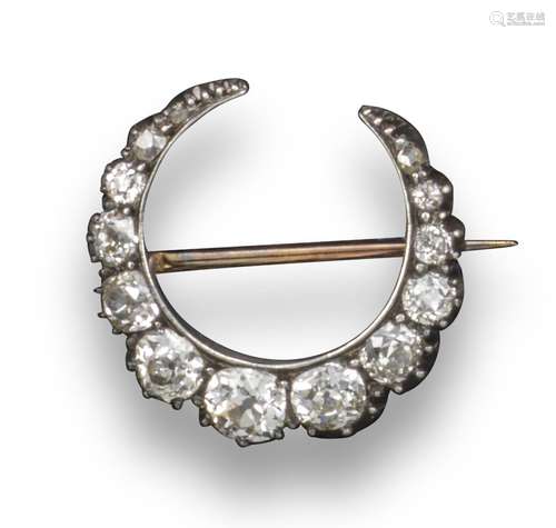 A late Victorian diamond closed crescent brooch, set with graduated old circular-cut diamonds in