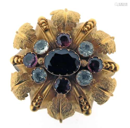 A Victorian gem-set gold brooch, of alternating foliate repousse and pellet decoration set with a