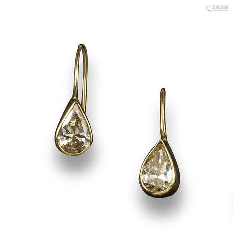 A pair of pear-shaped diamond drop earrings, set in rubover gold settings, 2cm high