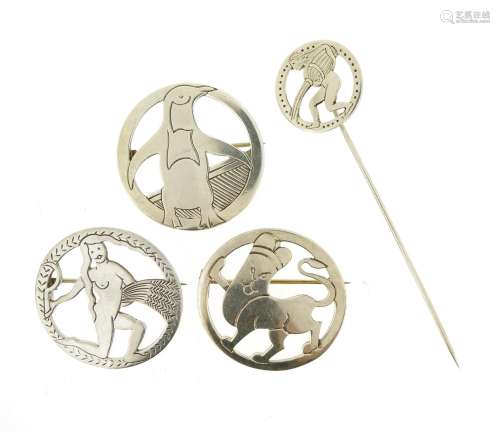 Three silver animal and zodiac brooches and a stick pin by H.G. Murphy, the circular silver brooches