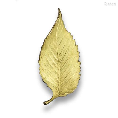 A gold leaf brooch by Tiffany & Co, the stylised leaf with textured decoration, signed Tiffany &