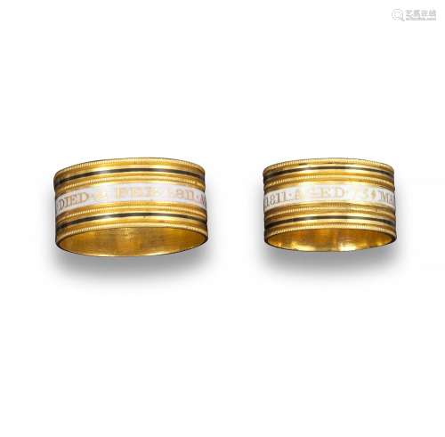 A pair of George III gold mourning rings, both 18ct yellow gold rings centred with a white enamel