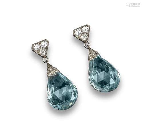 A pair of aquamarine and diamond drop earrings, the briolette-cut aquamarines suspend from a