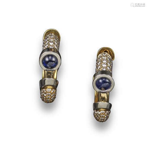 A pair of sapphire and diamond hoop earrings, set with a sapphire cabochon within pave-set