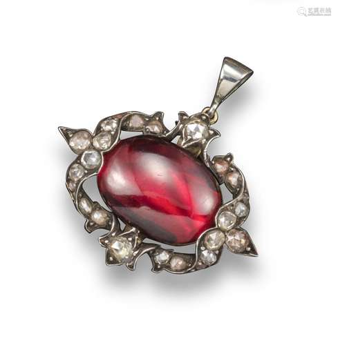 A George III garnet and diamond pendant, the oval-shaped cabochon garnet is set within a rose-cut