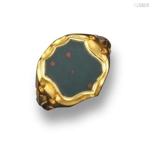 A Victorian shield-shaped bloodstone-mounted 18ct gold signet ring, carved with decorative