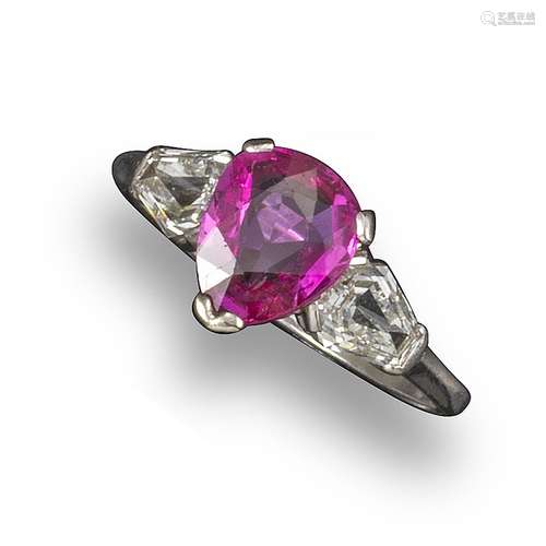 A pink sapphire and diamond three-stone ring, the pear-shaped sapphire set with two kite-shaped