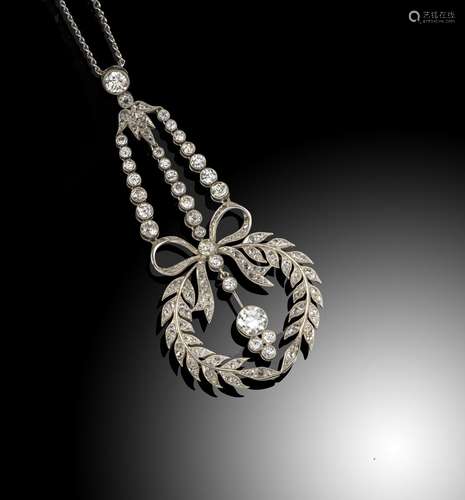 A Belle Йpoque diamond-set pendant, the centrepiece formed as laurels joined with a bow, set overall