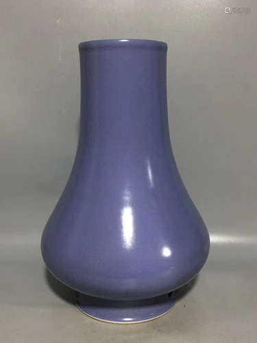 A BLUE GLAZED LONG-NECK BOTTLE