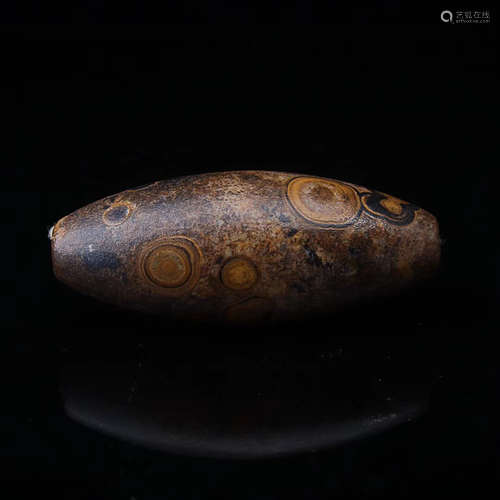 A NINE-EYE SHIYE ROCK DZI BEAD