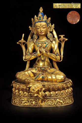 A GILT BRONZE MOLDED BUDDHA STATUE