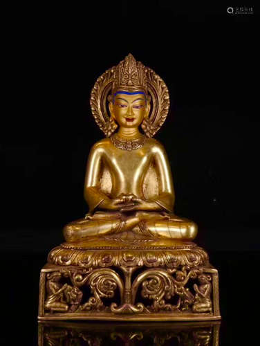 A GILT BRONZE MOLDED TIBET BUDDHA STATUE