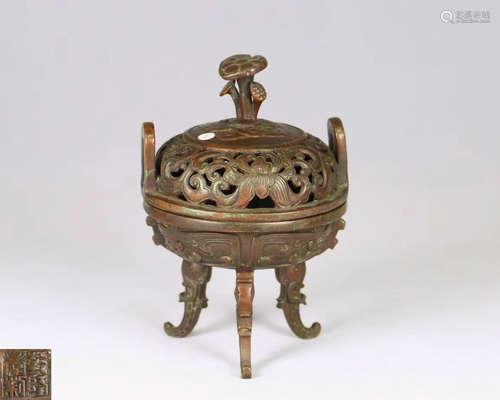 A BRONZE MOLDED TRIPOD CENSER