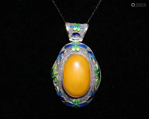 A MILA AMBER ENAMELED PENDANT