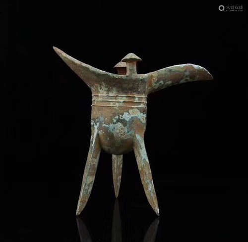 A BRONZE MOLDED THREE LEGS CUP