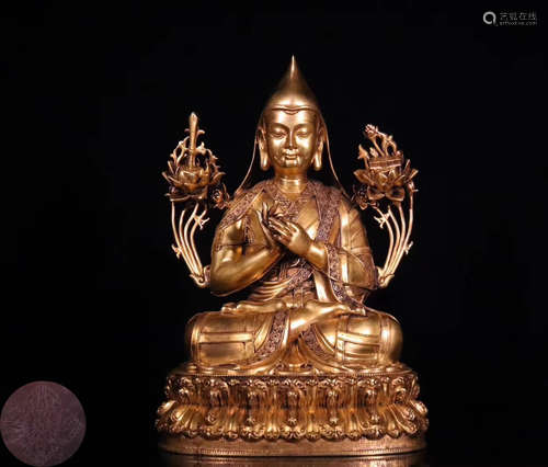 A GILT BRONZE MOLDED BUDDHA STATUE