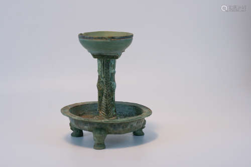 A BRONZE CANDLE HOLDER