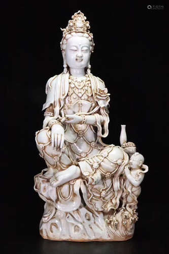 AN OLD TONGZIBAI GUANYIN FIGURE