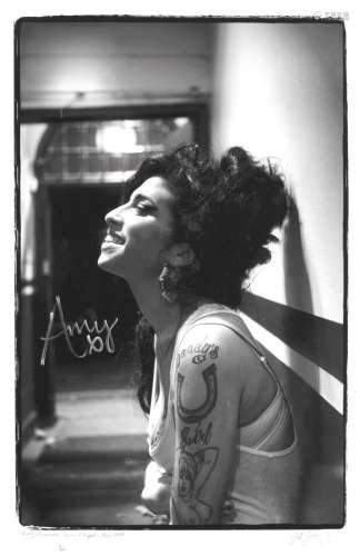 November 2006, Amy Winehouse: an autographed print of Amy Winehouse at Union Chapel by Jill Furmanovsky,
