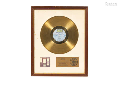 circa 1972, Emerson, Lake & Palmer: A 'Gold' award for the album Pictures At An Exhibition,