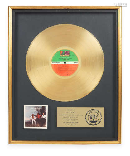 circa 1979, Emerson, Lake & Palmer: A 'Gold' award for the album Love Beach