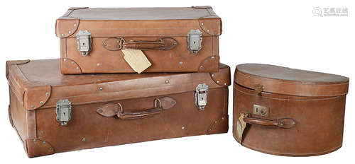 A set of two Vintage leather suitcases and a matching hat box(3)