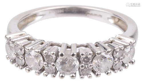 A white gold mounted diamond set half eternity ring