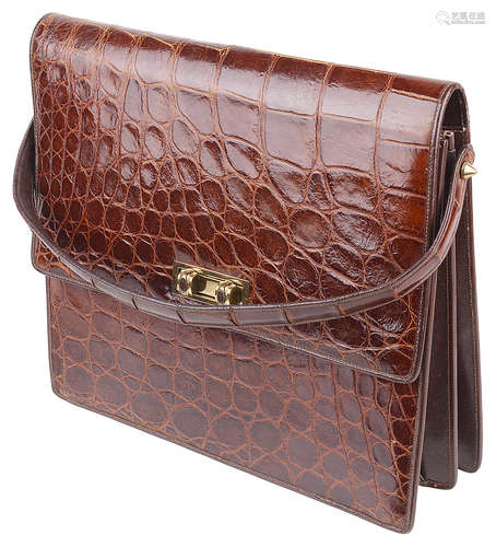 A light brown vintage ladies crocodile leather handbag