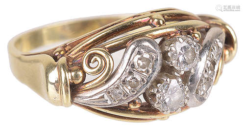 An attractive Continental, Edwardian style diamond set scroll ring