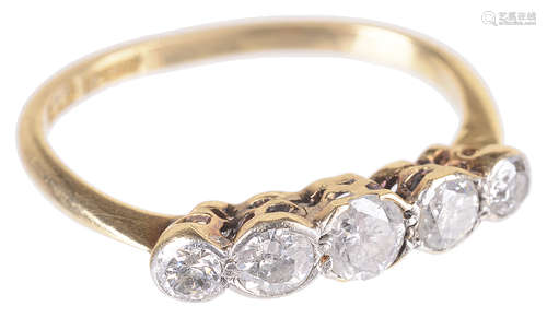 An early 20th c. five stone diamond set half hoop ring