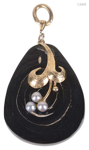 An unusual black spiral pendant with pearl motif