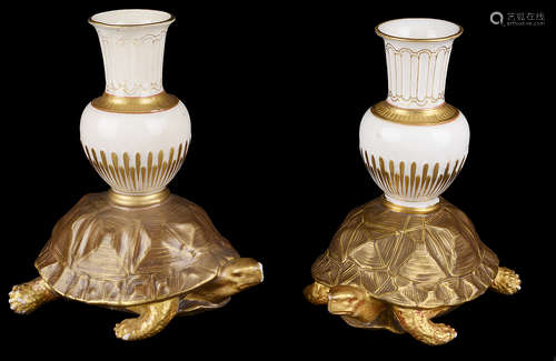 A pair of Royal Worcester aesthetic period tortoise candlesticks(2)