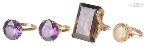 A large smoky quartz ring and three other gold mounted dress rings(4)