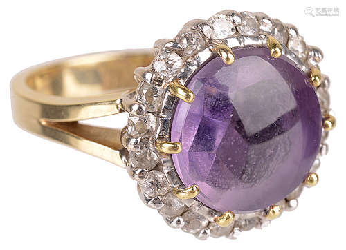 A large cabochon amethyst and diamond set cluster ring