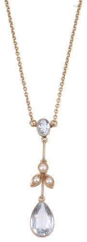 A delicate aquamarine and seed pearl drop pendant necklace