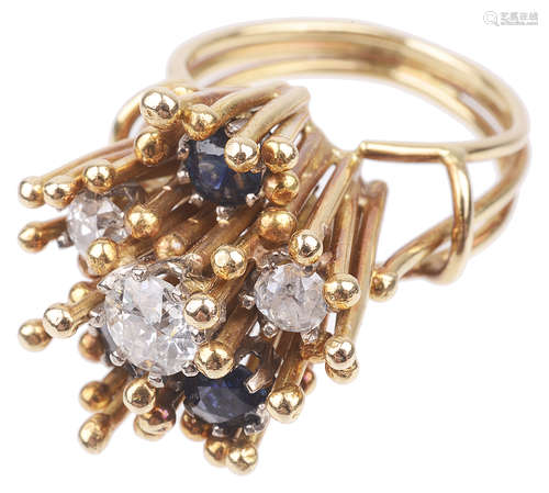 A contemporary Continental diamond and sapphire abstract floral ring