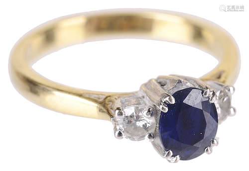 A delicate sapphire and diamond three stone ring