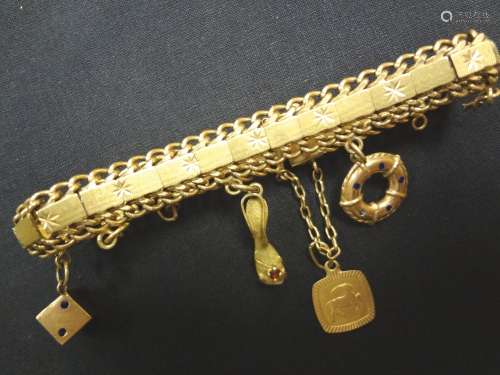 Pulsera de oro amarillo de 18 K. con cuatro colgan