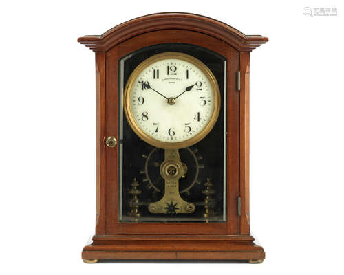 the dial signed Eureka Clock Co. Ltd, London and numbered 8093 An early 20th century mahogany electric mantel clock