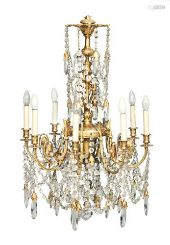 probably English An attractive 19th century gilt bronze and cut glass eight light chandelier