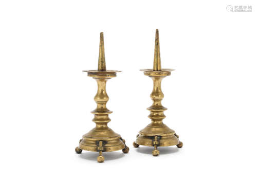 probably 18th century A pair of Continental brass pricket candlesticks