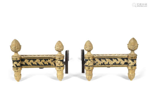 in the Louis XVI style  A pair of late 19th century gilt and patinated bronze chenet cast by Bouhon Freres