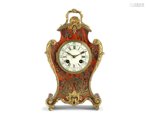 in the Louis XV style, the movement stamped for Samuel Marti  A late 19th century French gilt bronze mounted cut brass and scarlet tortoiseshell 'Boulle' mantel clock