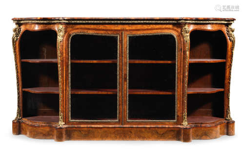 An early Victorian gilt bronze mounted figured walnut and tulipwood crossbanded low display cabinet