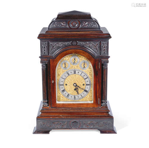 An impressive Victorian carved mahogany chiming bracket clock