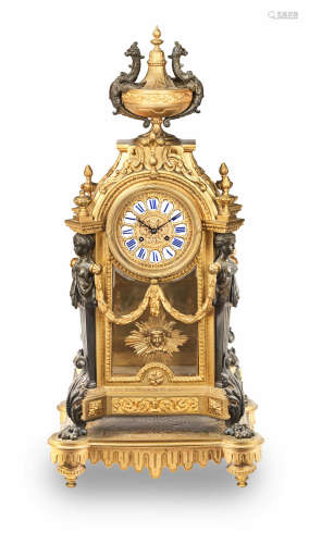 in the Louis XIV style  A late 19th century French gilt and patinated bronze mantel clock