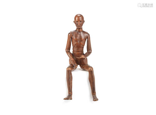 probably French A late 19th / early 20th century Continental carved and stained wood artists lay figure